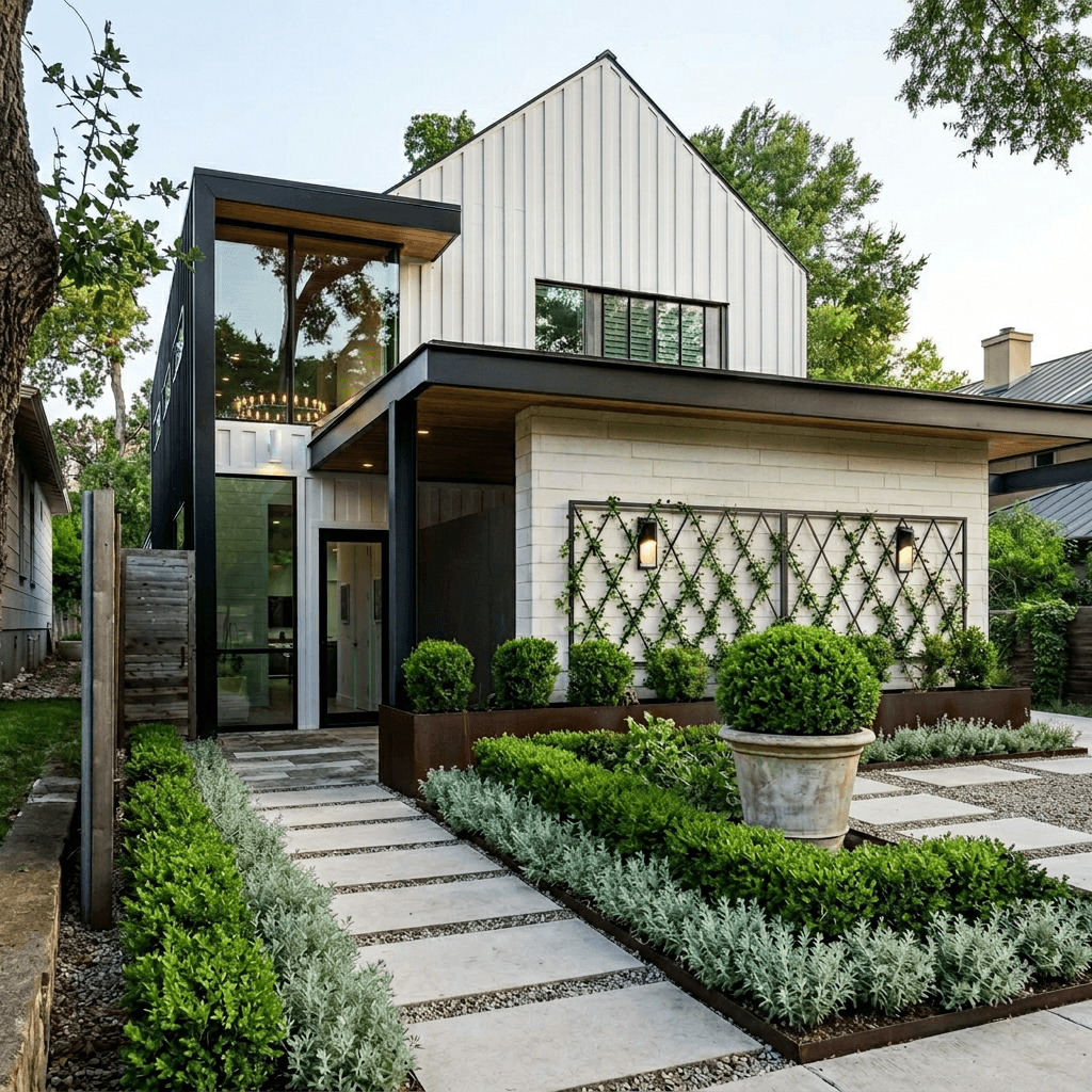 Formal courtyard front yard with clipped boxwood hedge, espaliered vines on a metal trellis, lavender border, gravel between large stone slabs, and a classical urn with spherical boxwood topiary.